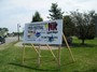 Festival sign with a slant